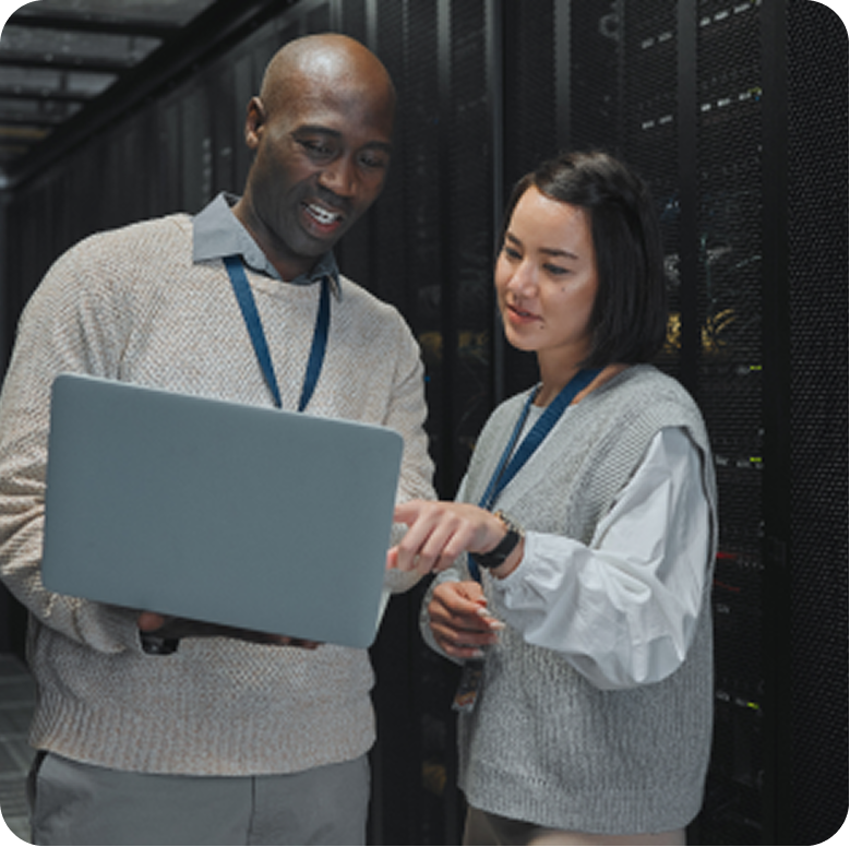 Colleagues reviewing a project on laptop